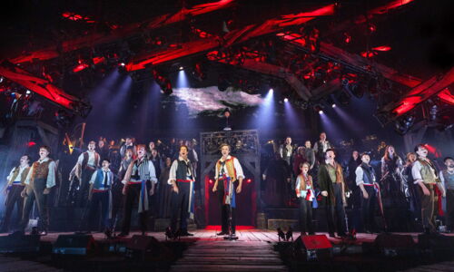 1_Enjolras (James D. Gish) and Ensemble - Photocredit Danny Kaan.jpg